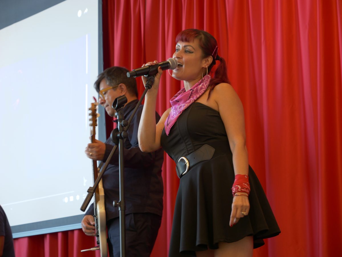 Denise Carlos of Las Cafeteras performing at the workshop.