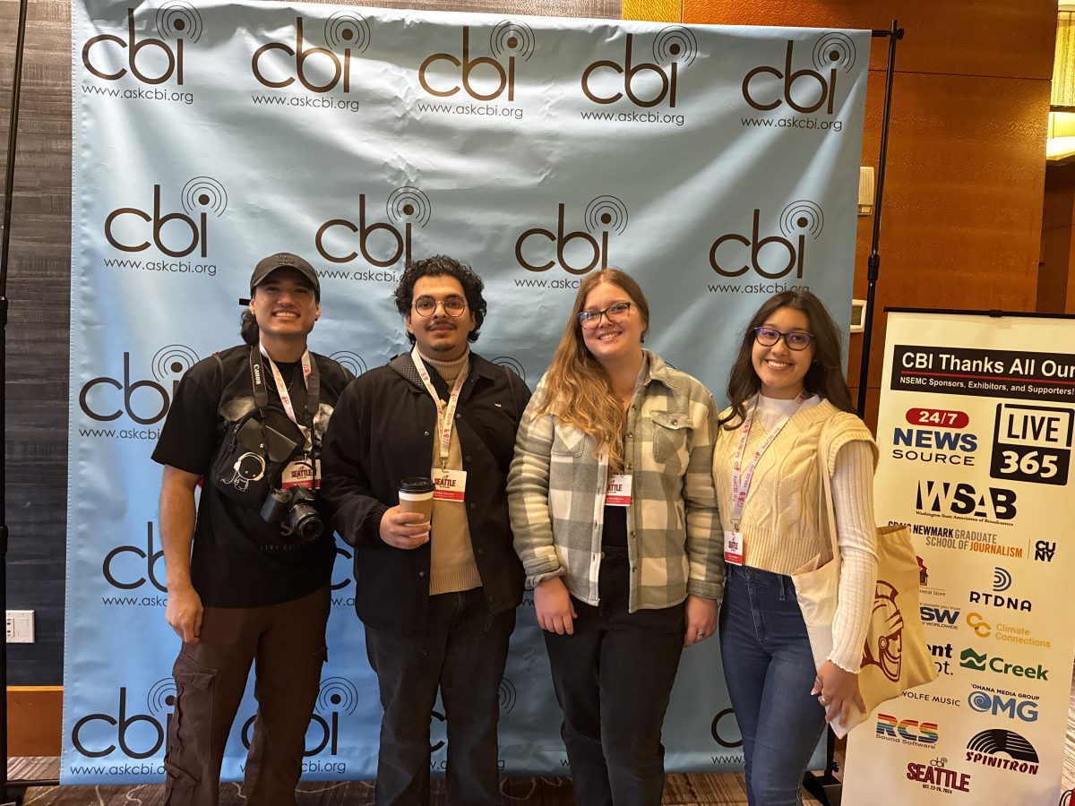 (From left to right) Nico Salazar, Robbie Herrera, Katelyn Hawthorne and Gisele Caballero standing together in front of a College Broadcaster Inc. themed backdrop at the 2024 National Student Media Convention in the Renaissance Hotel in Seattle, Washington.