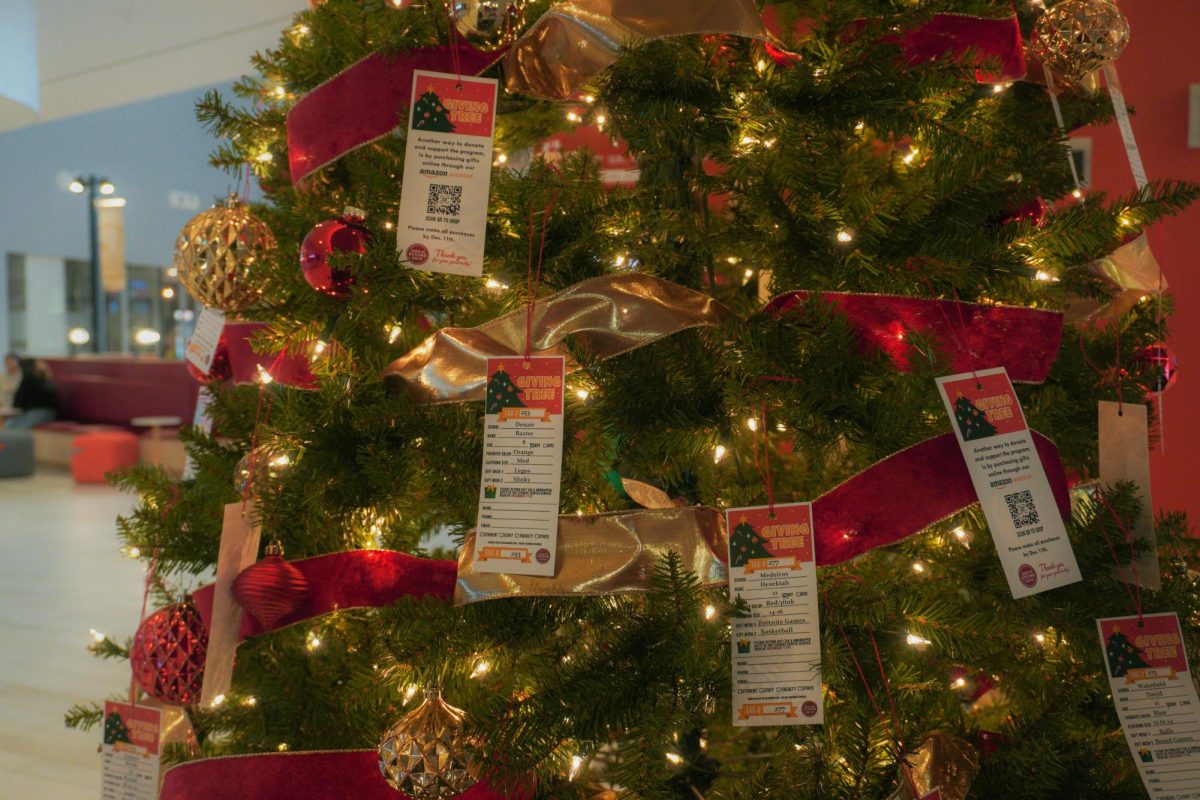 Gift tags featuring elementary school students' names, their wish lists, and a QR code linking to an Amazon wish list.