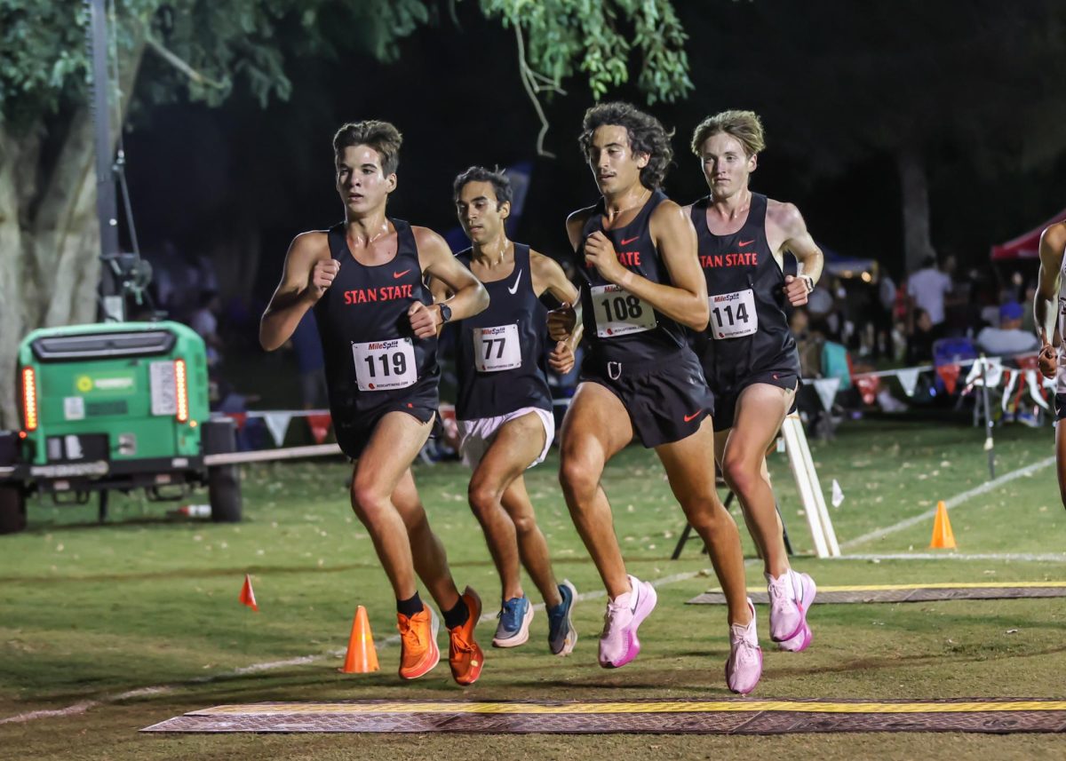 Stan State Men's Cross Country running in the Kim Duyst Twilight Invitational. 