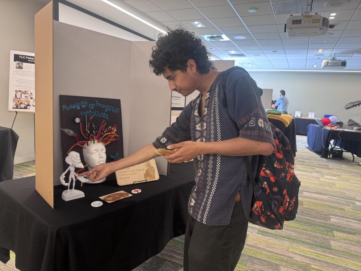 Jared Medina (Sophomore, Creative Media) at the poster symposium held by the Warrior Fab Lab
