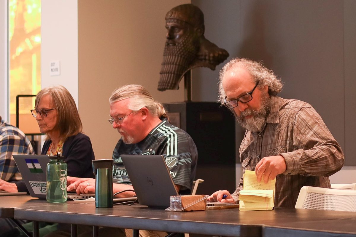 CFA Chapter President Dave Colnic (pictured right) checks his notes during the March 11th Senate meeting. (Signal File Photo)