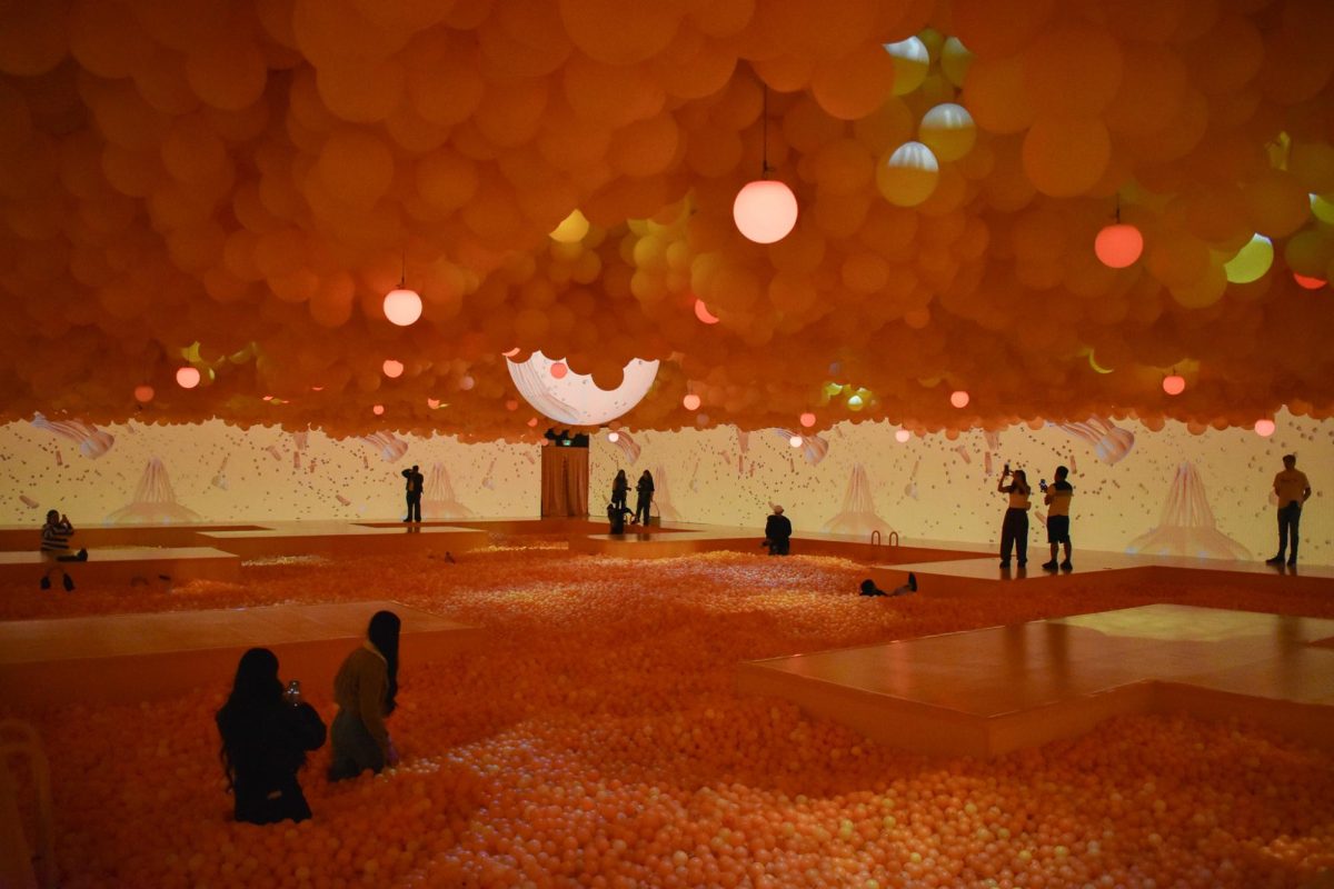 Students exploring the Balloon Museum and immersing themselves with the ball pit in the Hyperfeeling exhibit.