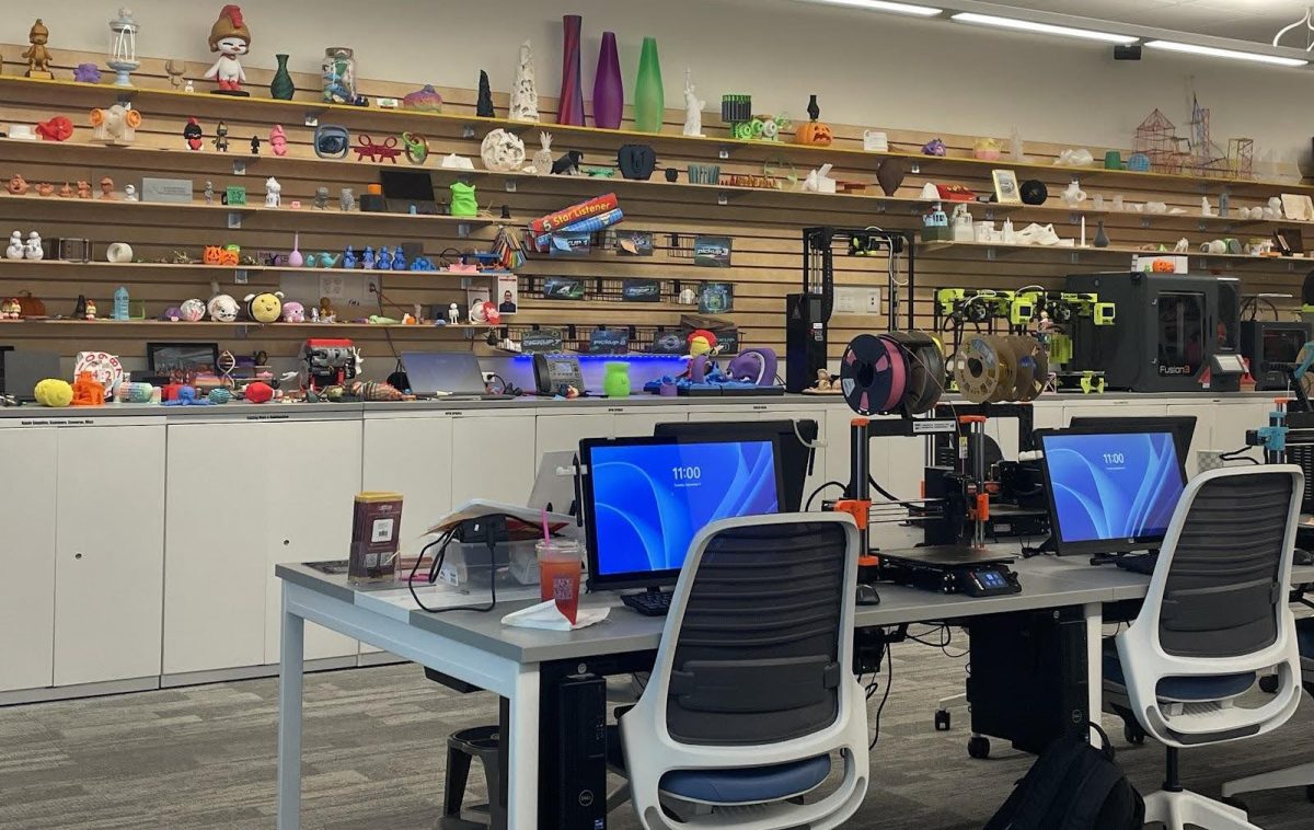 Inside the Lab, The shelves above the Fab Labs computers,softwares available, showcase items students created in the lab. 