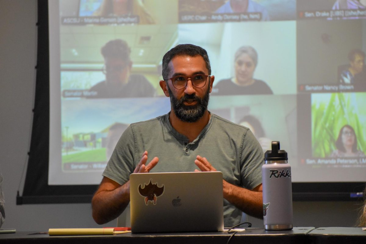 Speaker Arya Alami talking with senators about their agenda at the academic senate meeting on Tuesday, March 10, 2026, in Turlock.