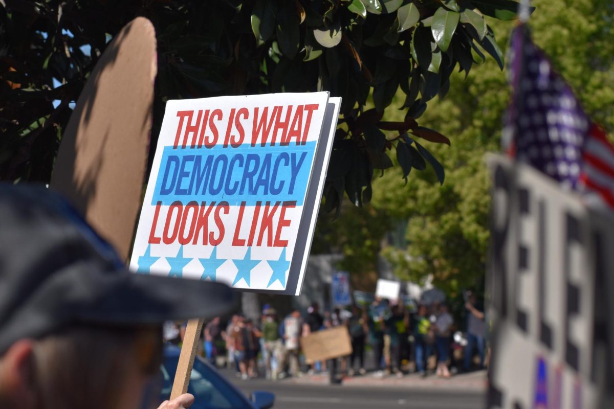 Protestors march towards 5 points while chanting "No crowns no clowns," on Saturday, March 28,  2026 at the No Kings Protest in Modesto.