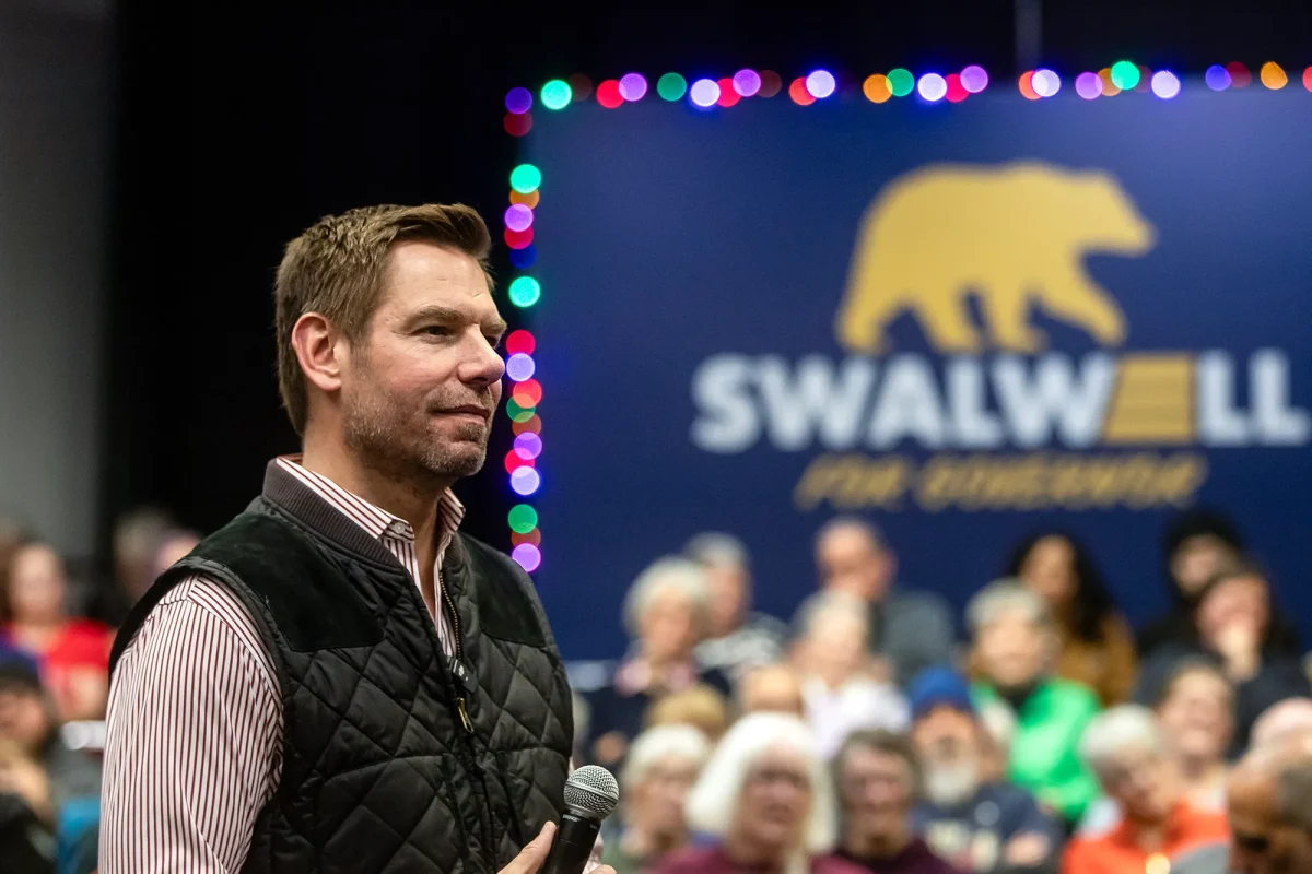 U.S. Rep. Eric Swalwell listens to questions from the audience during a town hall he hosted at the Fresno Convention & Entertainment Center in downtown Fresno on Dec. 15, 2025. Credit: Larry Valenzuela / CalMatters/CatchLight Local