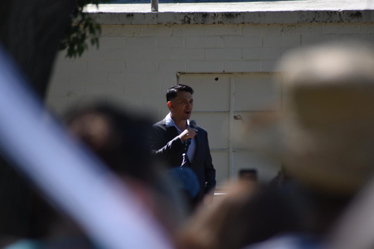 Michael Masuda talking to protestors before they start their march on Saturday, March 28,  2026 at the No Kings Protest in Graceada park in Modesto.
